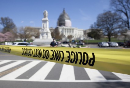 The north front of the U.S. Capitol is closed and a parameter created with police tape, Saturday, April 11, 2015, in Washington.   Police say the U.S. Capitol is on lockdown as a precaution after shots were fired in what appears to be an attempted suicide.  (AP Photo/Carolyn Kaster)