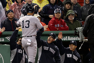 BOSTON, MA - MAY 01: Alex Rodriguez #13 of the New York Yankees returns to the dugout after hitting a two-run home run in the third inning during the game against the Boston Red Sox at Fenway Park on May 1, 2016 in Boston, Massachusetts.   Adam Glanzman/Getty Images/AFP