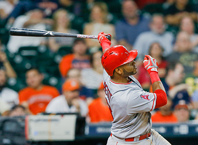 HOUSTON, TX - JUNE 20: Gregorio Petit #8 of the Los Angeles Angels of Anaheim hits a grand slam in the ninth inning against the Houston Astros at Minute Maid Park on June 20, 2016 in Houston, Texas.   Bob Levey/Getty Images/AFP