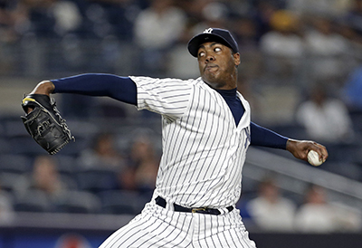New York Yankees relief pitcher Aroldis Chapman delivers a pitch during the ninth inning of a baseball game against the Boston Red Sox on Sunday, July 17, 2016, in New York. The Yankees won 3-1. (AP Photo/Adam Hunger)