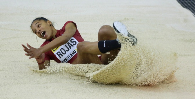 Venezuela's Yulimar Rojas lands in the sand after a jump in the women's triple jump final during the World Indoor Athletics Championships, Saturday, March 19, 2016, in Portland, Ore. (AP Photo/Rick Bowmer)