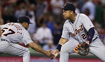Detroit Tigers relief pitcher Francisco Rodriguez (57) low-fives first baseman Miguel Cabrera after the Tigers defeated the Boston Red Sox 9-8 during a baseball game at Fenway Park, Tuesday, July 26, 2016, in Boston. (AP Photo/Charles Krupa)