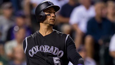 DENVER, CO - AUGUST 3: Carlos Gonzalez #5 of the Colorado Rockies watches the flight of a sixth inning solo homerun off of Julio Urias #7 of the Los Angeles Dodgers at Coors Field on August 3, 2016 in Denver, Colorado.   Dustin Bradford/Getty Images/AFP == FOR NEWSPAPERS, INTERNET, TELCOS & TELEVISION USE ONLY ==  BBN-SPO-LOS-ANGELES-DODGERS-V-COLORADO-ROCKIES