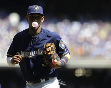 Milwaukee Brewers' Orlando Arcia blows a bubble during an MLB baseball game against the Chicago Cubs Monday, Sept. 5, 2016, in Milwaukee. (AP Photo/Aaron Gash)