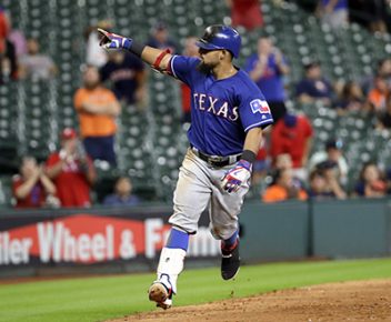 Texas Rangers' Rougned Odor points to the dugout as he runs the bases after hitting a home run against the Houston Astros during the 12th inning of a baseball game Monday, Sept. 12, 2016, in Houston. (AP Photo/David J. Phillip)