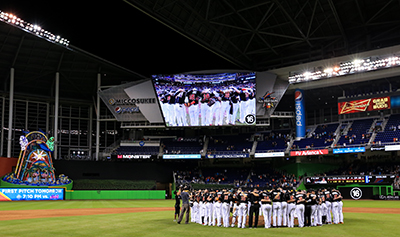 MIAMI, FL - SEPTEMBER 26: Miami Marlins players all wearing jerseys bearing the number 16 and name Fernandez honor the late Jose Fernandez after the game against the New York Mets at Marlins Park on September 26, 2016 in Miami, Florida.   Rob Foldy/Getty Images/AFP