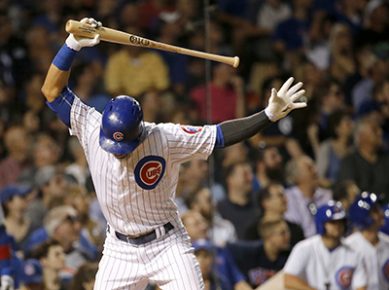 Chicago Cubs' Willson Contreras slams his bat down after popping out to Milwaukee Brewers' Ramon Flores with two runners on during the fourth inning of the second game of a baseball doubleheader, Tuesday, Aug. 16, 2016, in Chicago. (AP Photo/Charles Rex Arbogast)