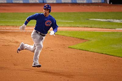 CLEVELAND, OH - NOVEMBER 02: Willson Contreras #40 of the Chicago Cubs runs after hitting an RBI double to score Ben Zobrist #18 (not pictured) during the fourth inning against the Cleveland Indians in Game Seven of the 2016 World Series at Progressive Field on November 2, 2016 in Cleveland, Ohio.   Gregory Shamus/Getty Images/AFP