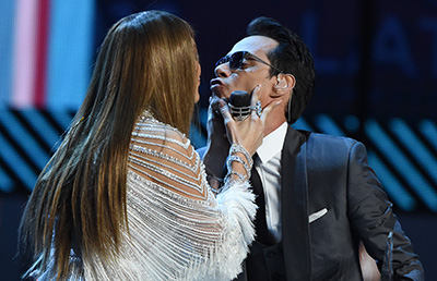 Jennifer Lopez (L) kisses Marc Anthony during the show of the 17th Annual Latin Grammy Awards on November 17, 2016, in Las Vegas, Nevada.  / AFP PHOTO / Valerie MACON